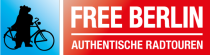 Silhouette of bear on bicycle with 'Free Berlin' text on red background.